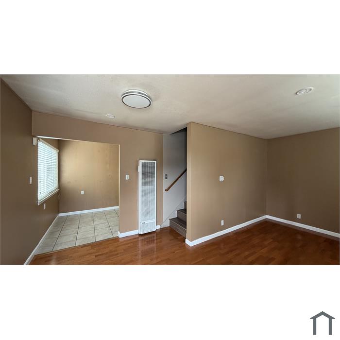 Living area looking toward the kitchen and stairs