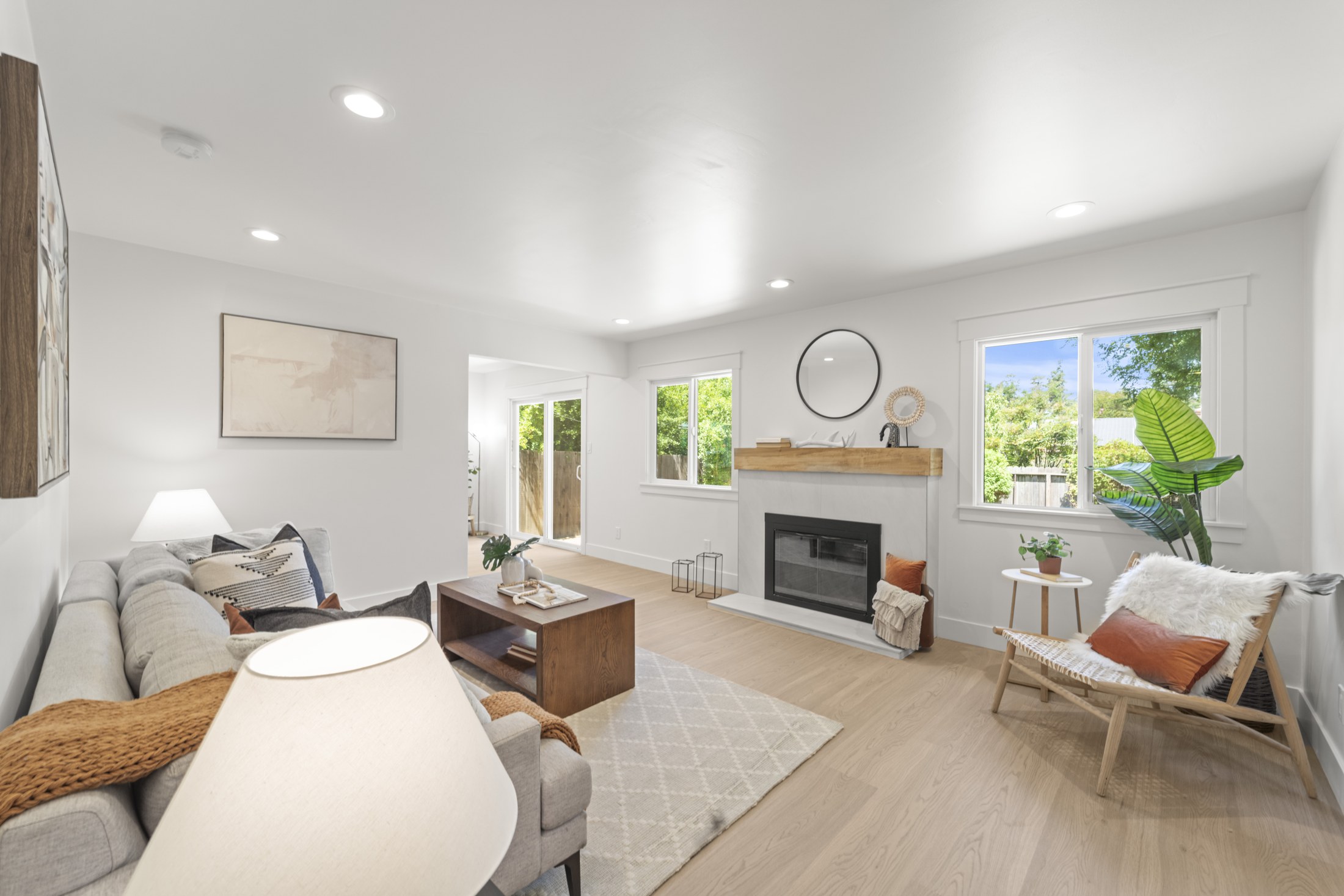 Living room with fireplace and large windows