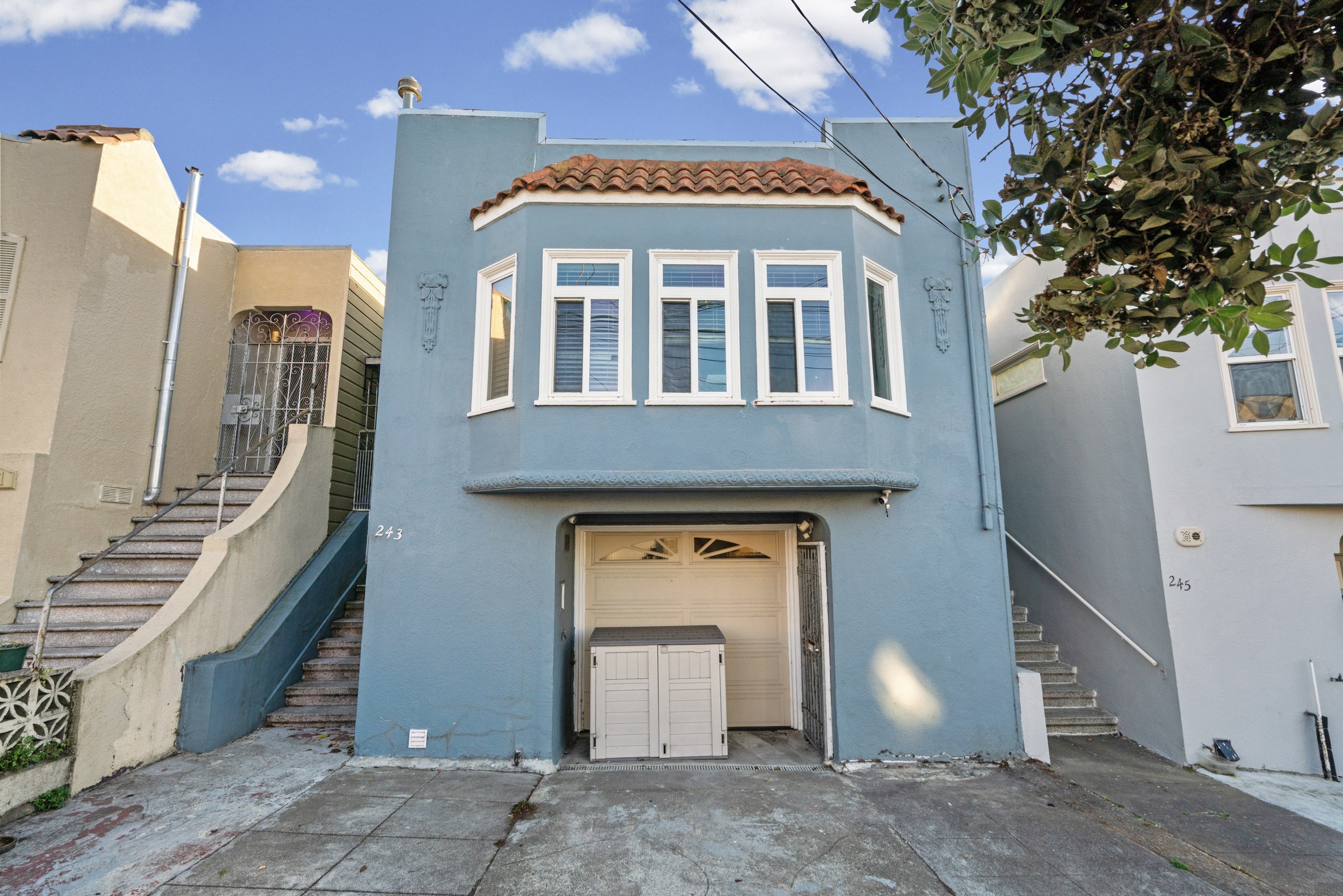 Blue facade of 243 Farallones Street