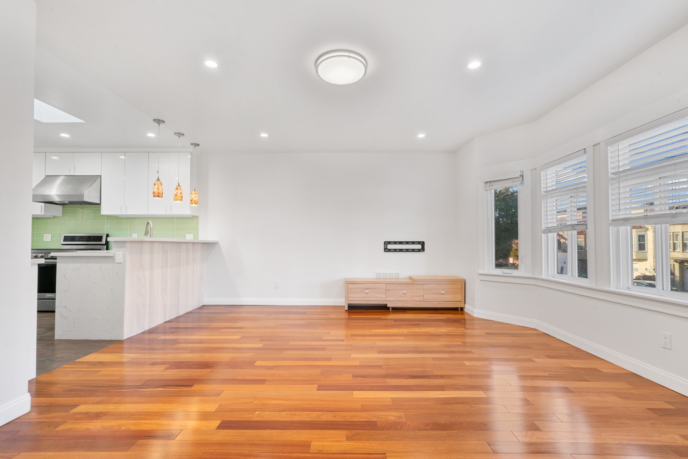 Light-filled living area with bay windows and an open kitchen