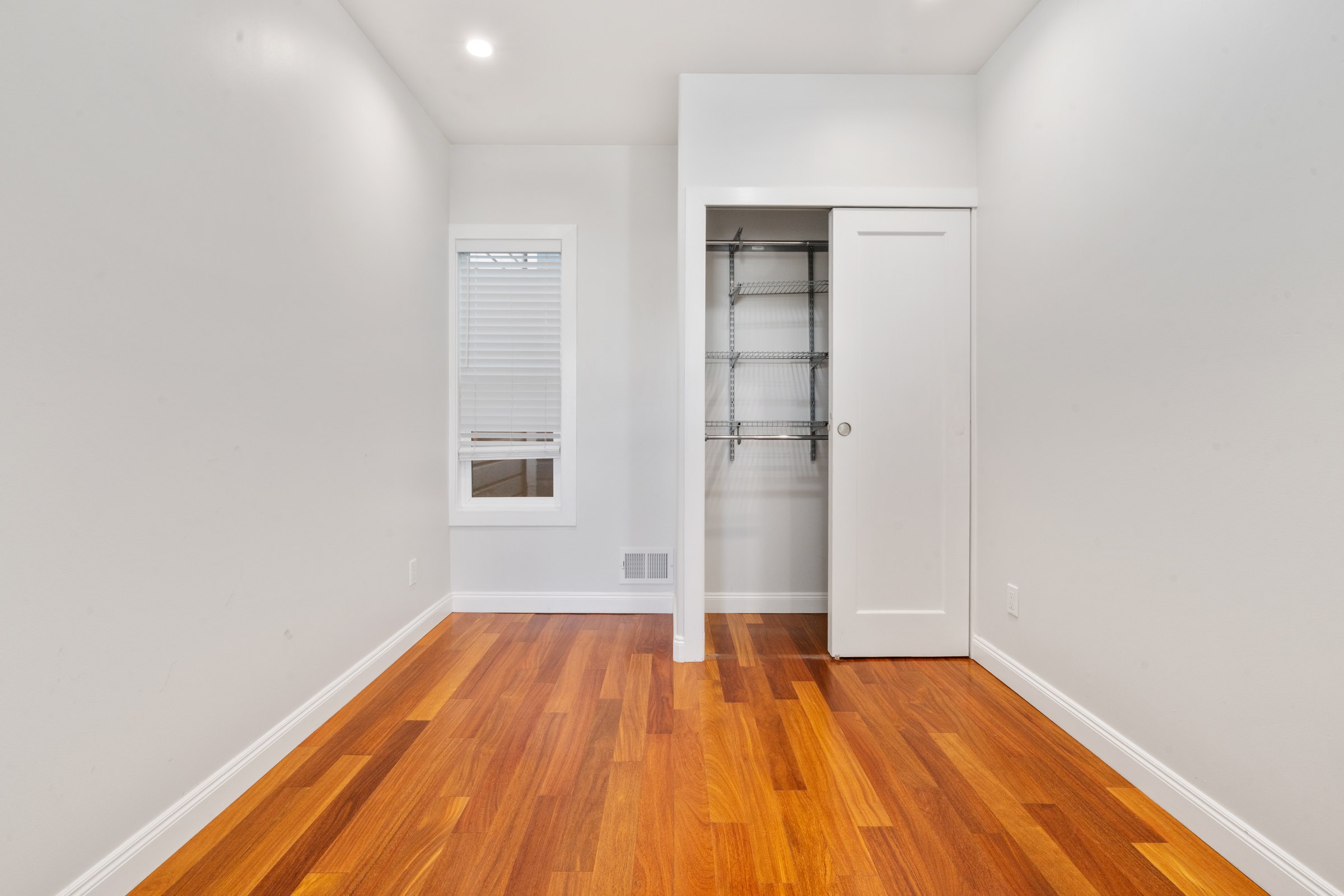 Upper residence bedroom and adjoining hallway