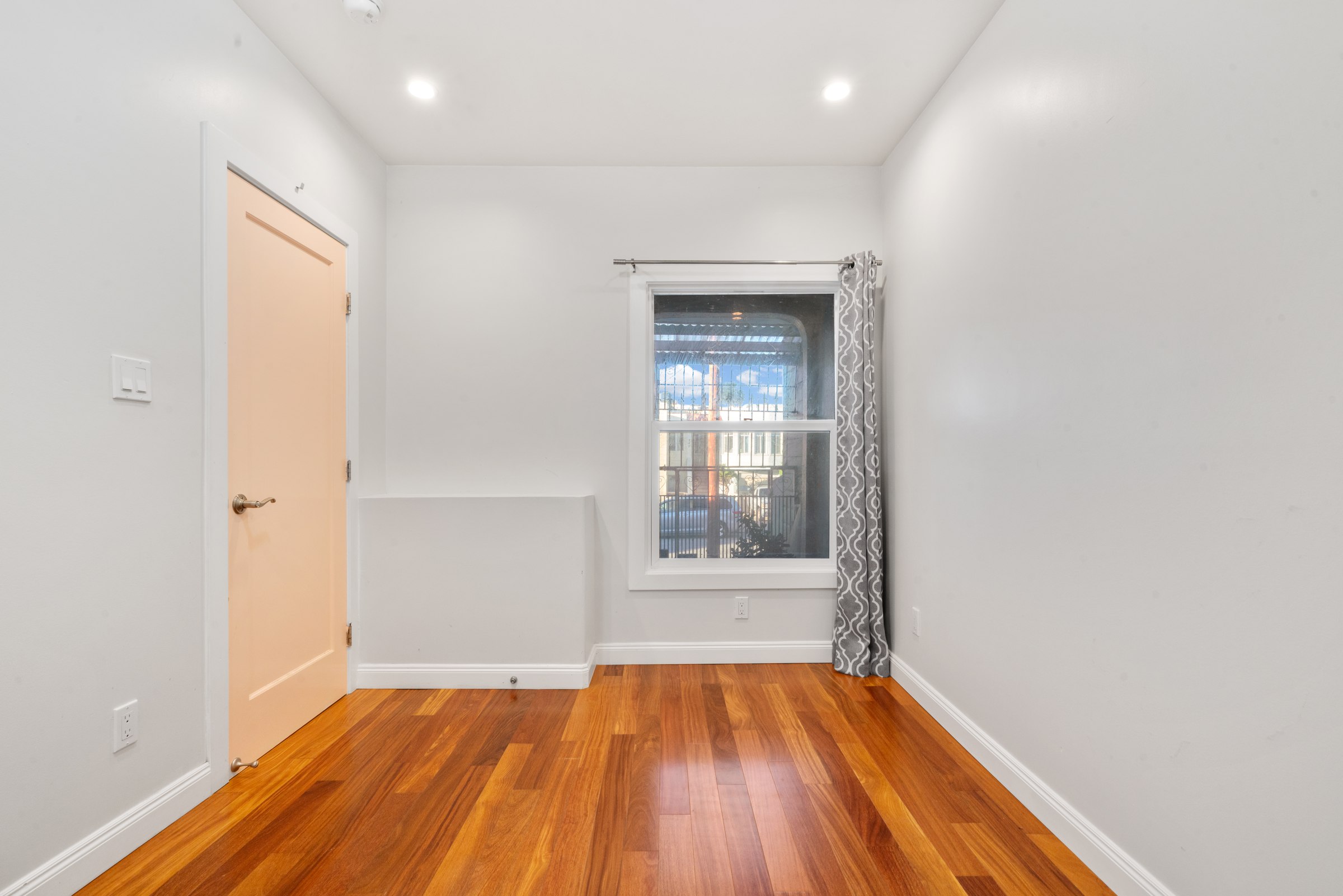 Upper residence bedroom and adjoining hallway