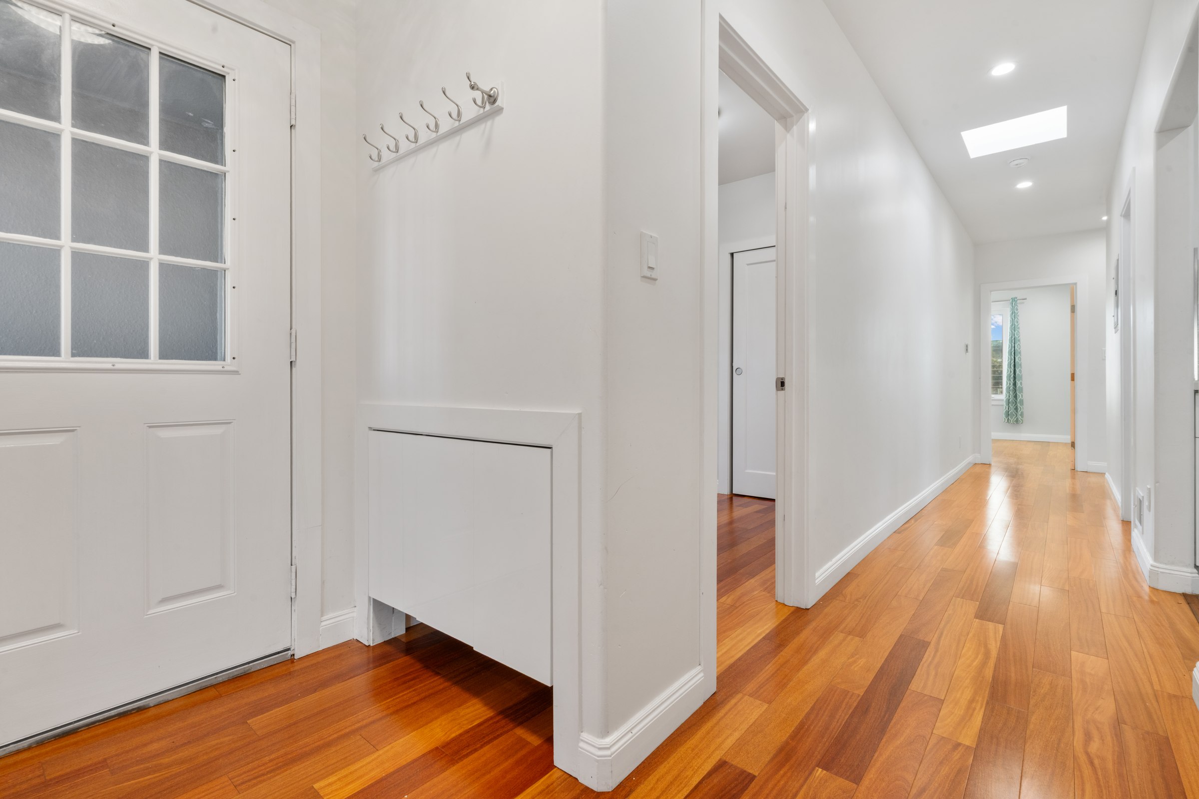 Upper residence bedroom and adjoining hallway