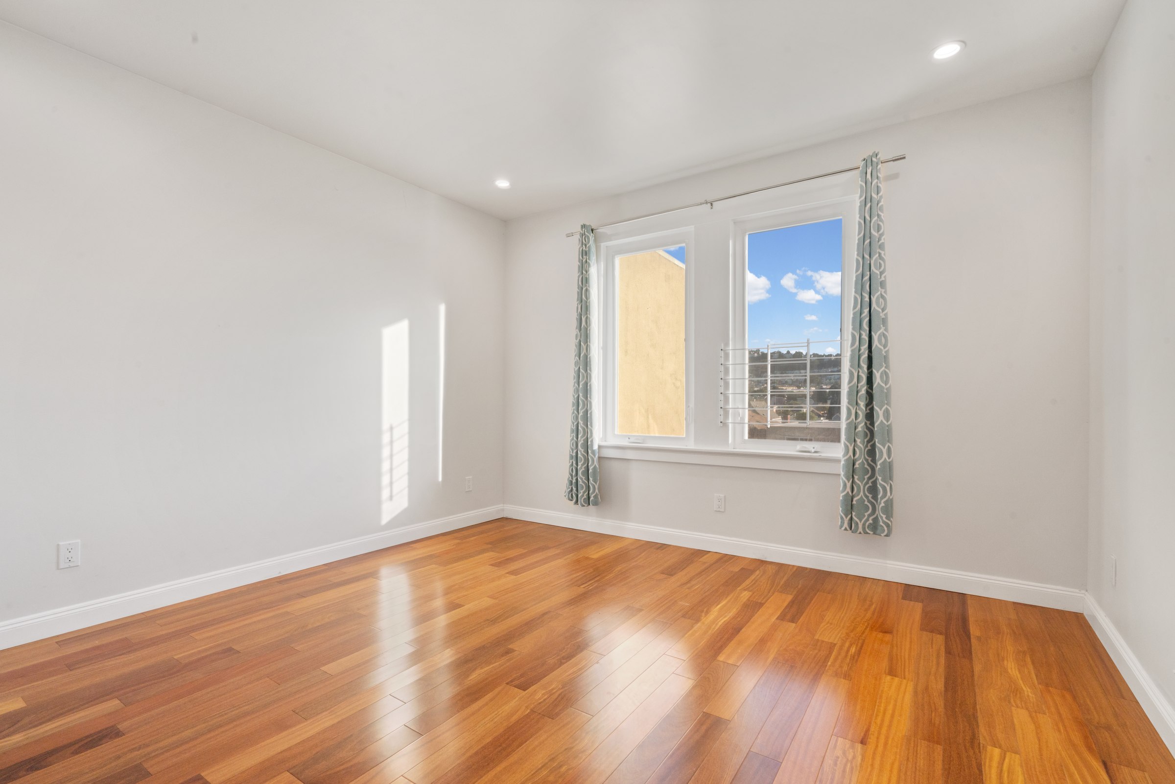 Upper residence bedroom and adjoining hallway