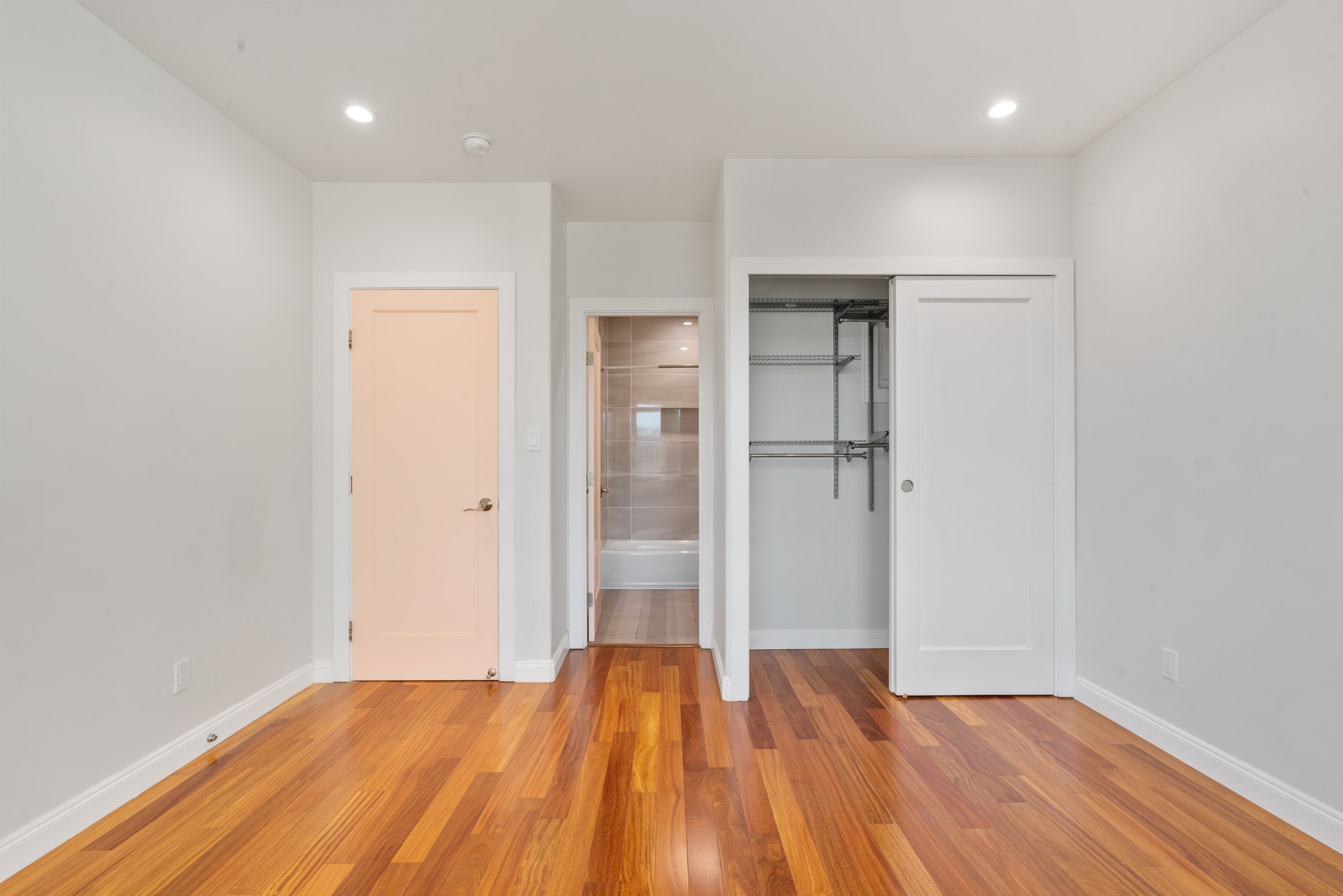 Upper residence bedroom and adjoining hallway