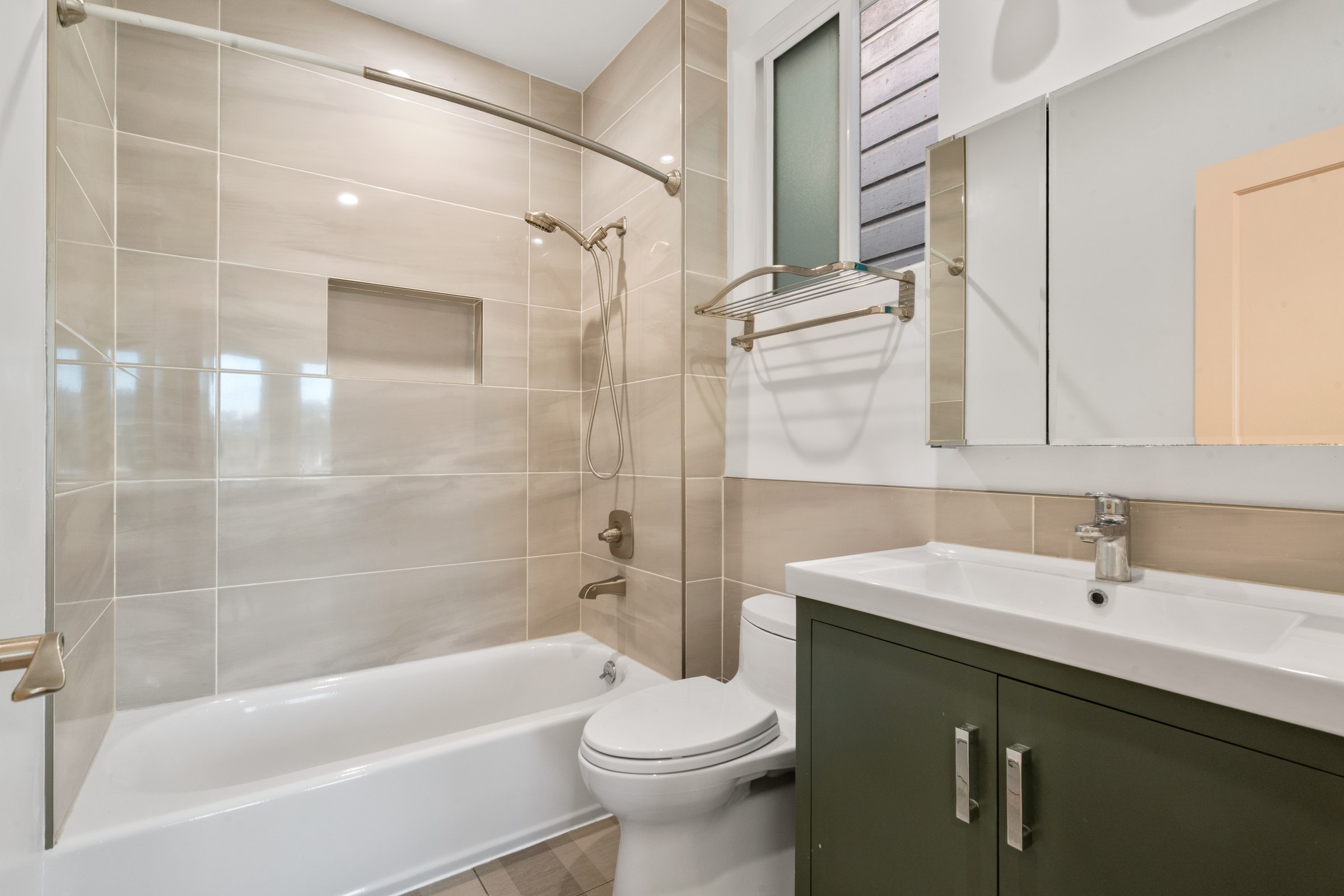 Upper residence bathroom with tiled bathing area