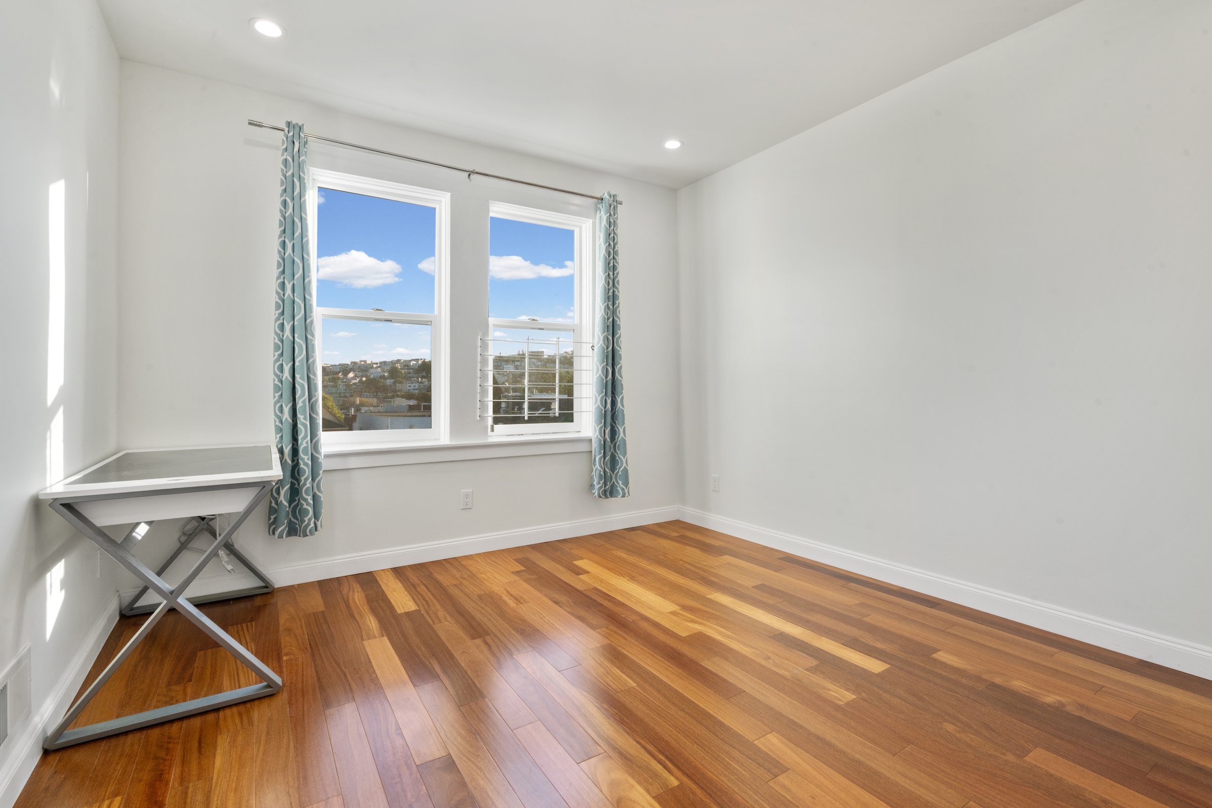 Upper residence bedroom and adjoining hallway