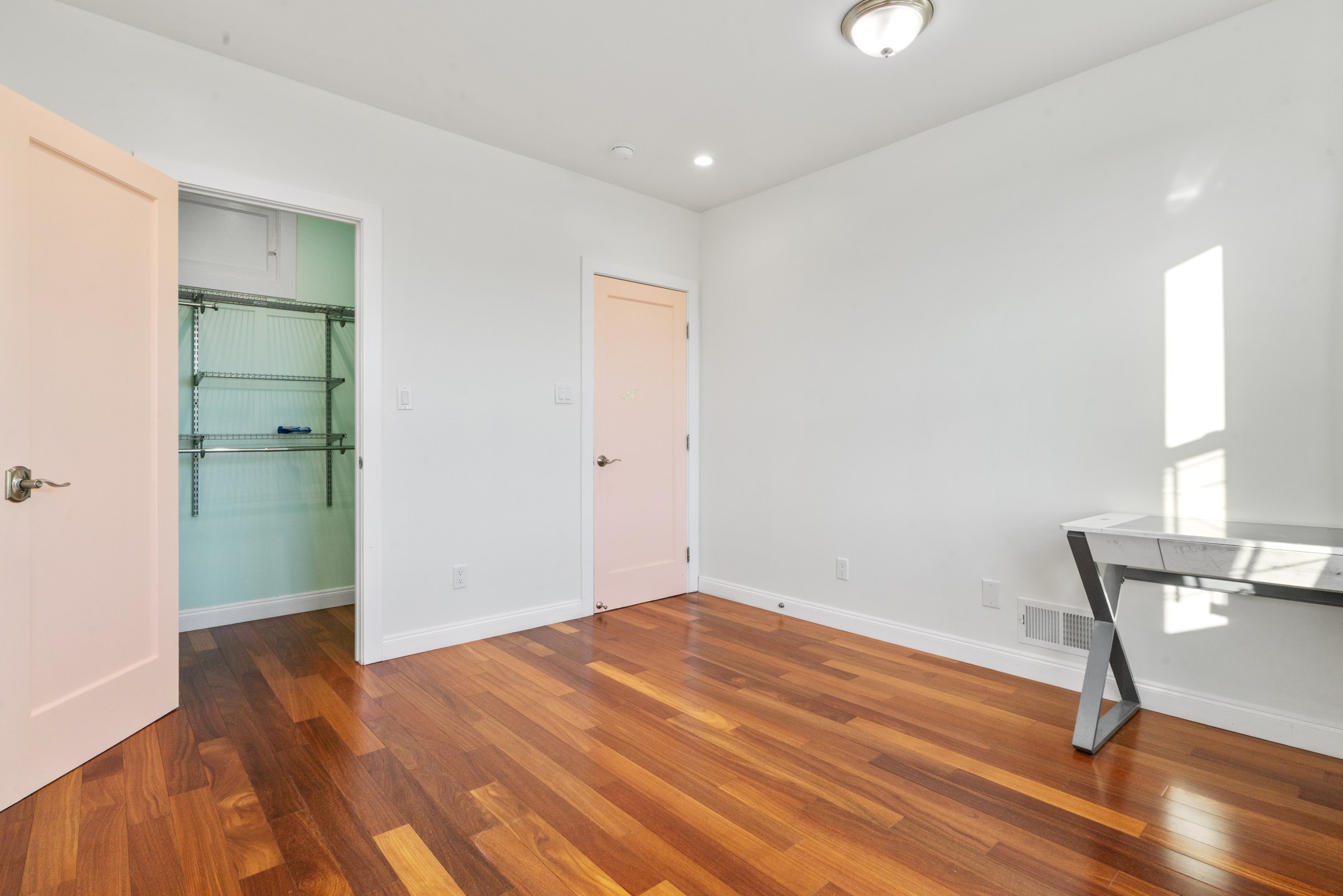 Upper residence bedroom and adjoining hallway