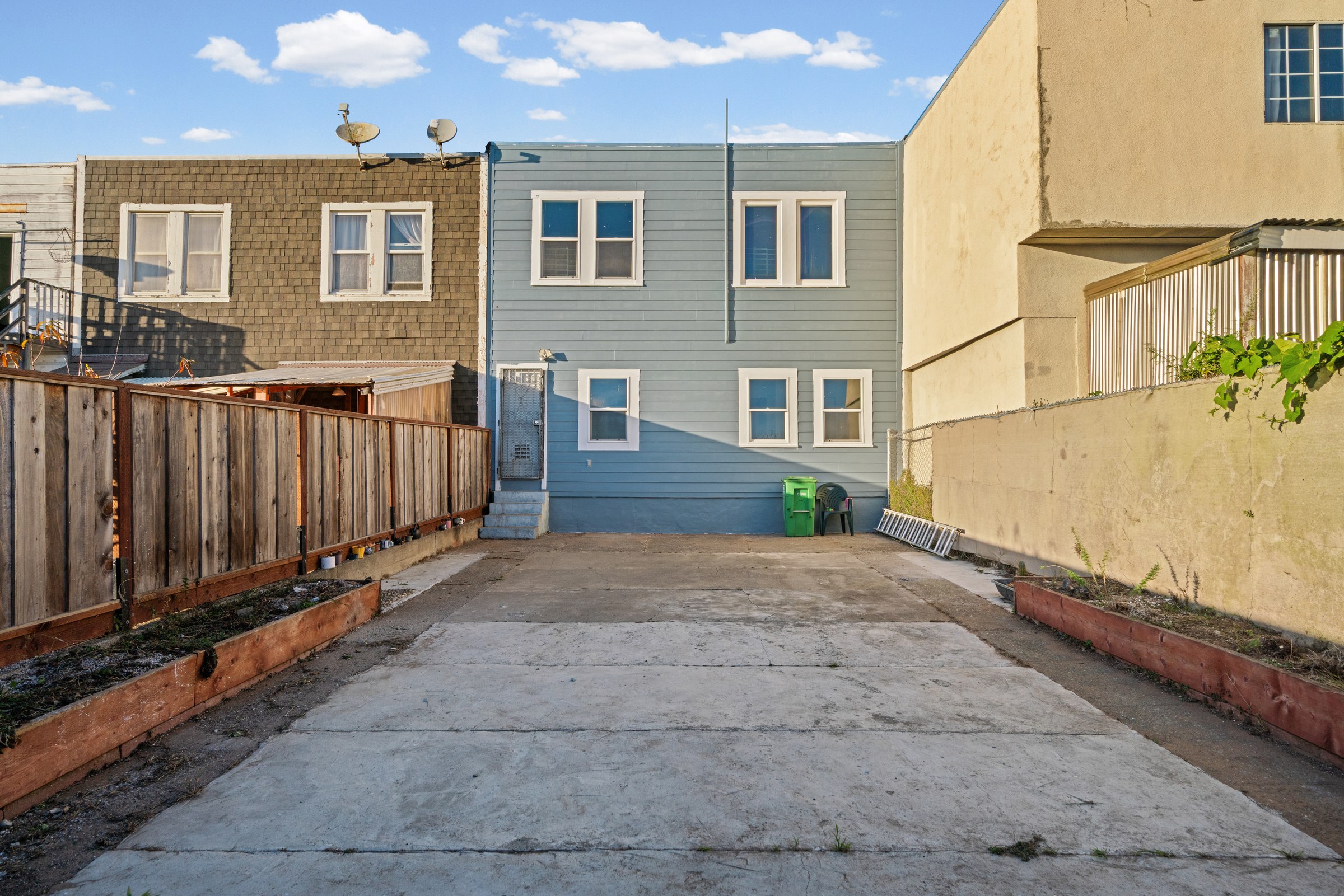 Paved backyard and rear of the property