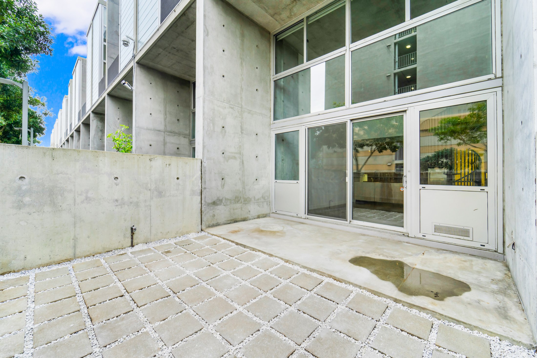 Patio beside the glass facade
