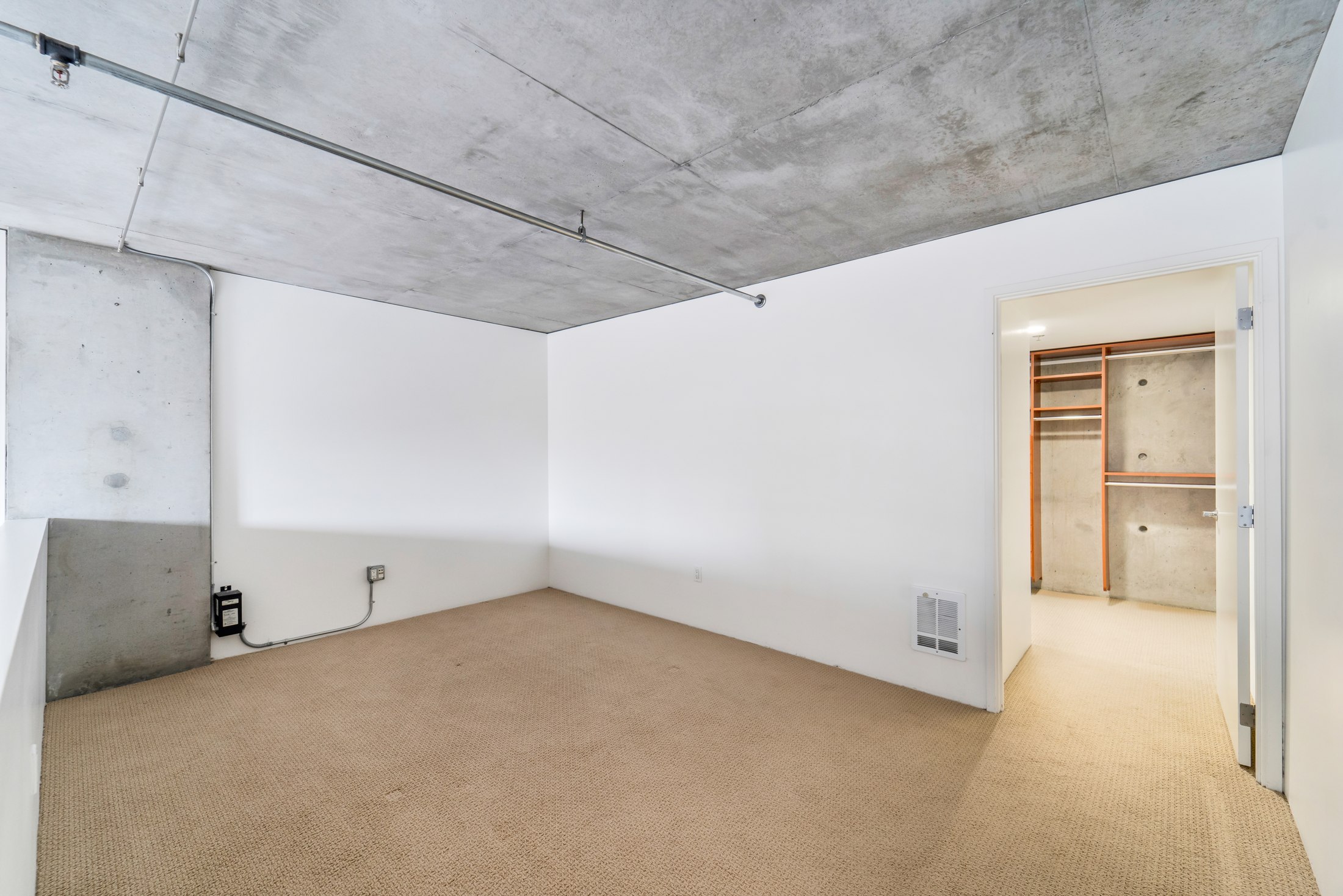 Upper-level open loft bedroom