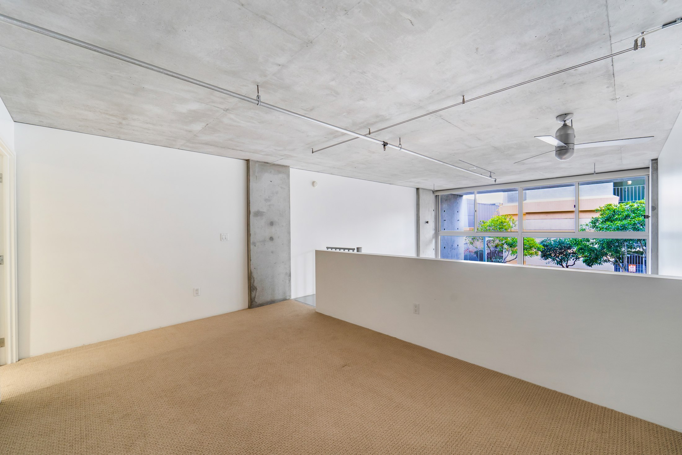 Open loft bedroom overlooking the living area