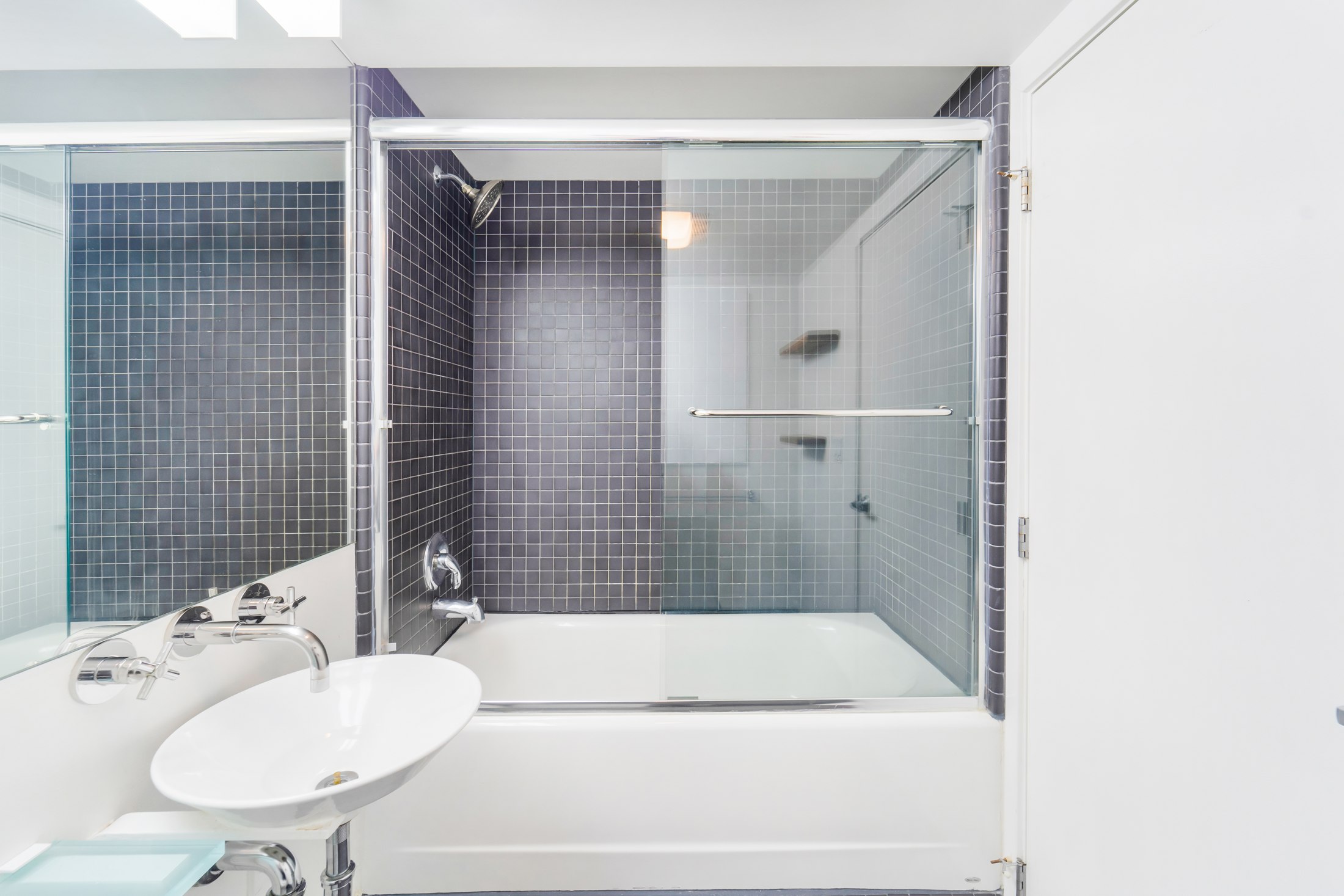 Full bathroom with tub and shower